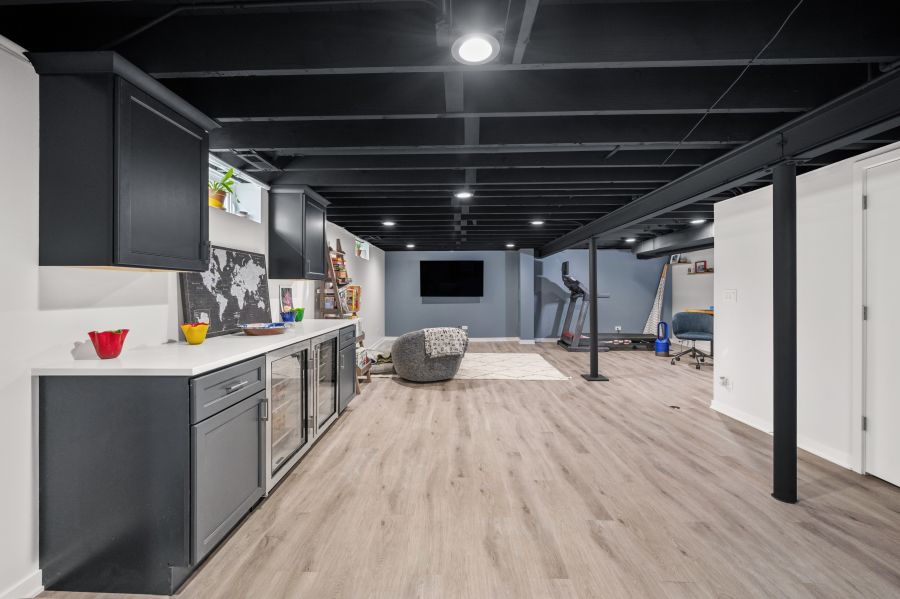 Functional Basement With Black Ceiling