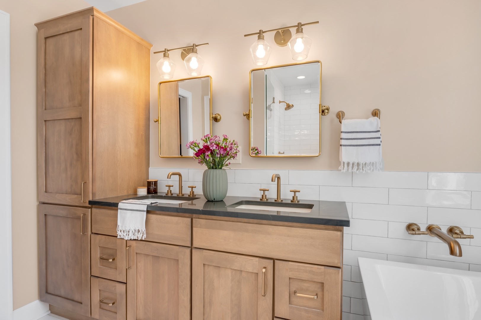 Chicago bathroom remodel double sink white tub wood vanity