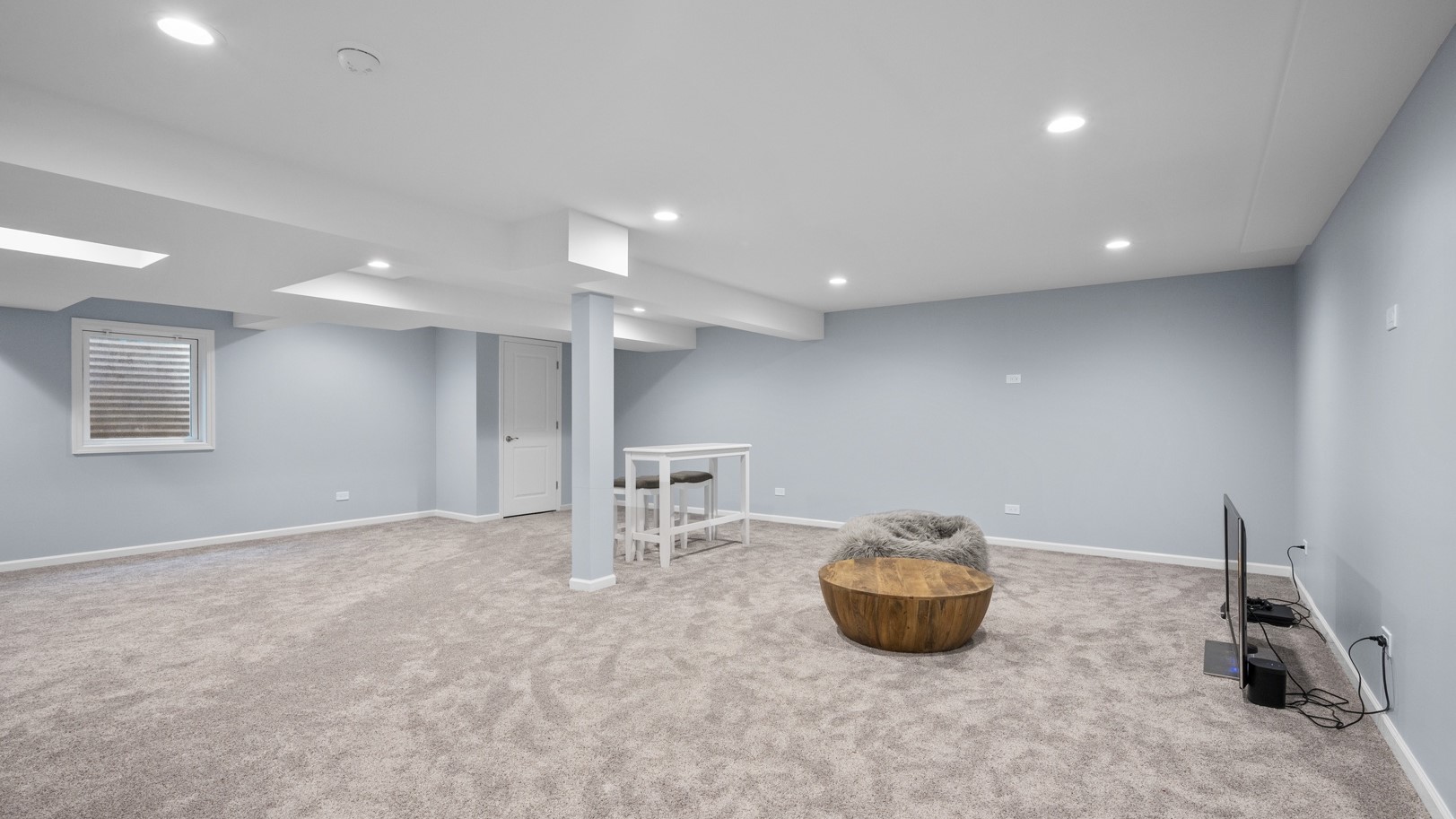 White basement remodel with blue walls in Arlington Heights, IL home