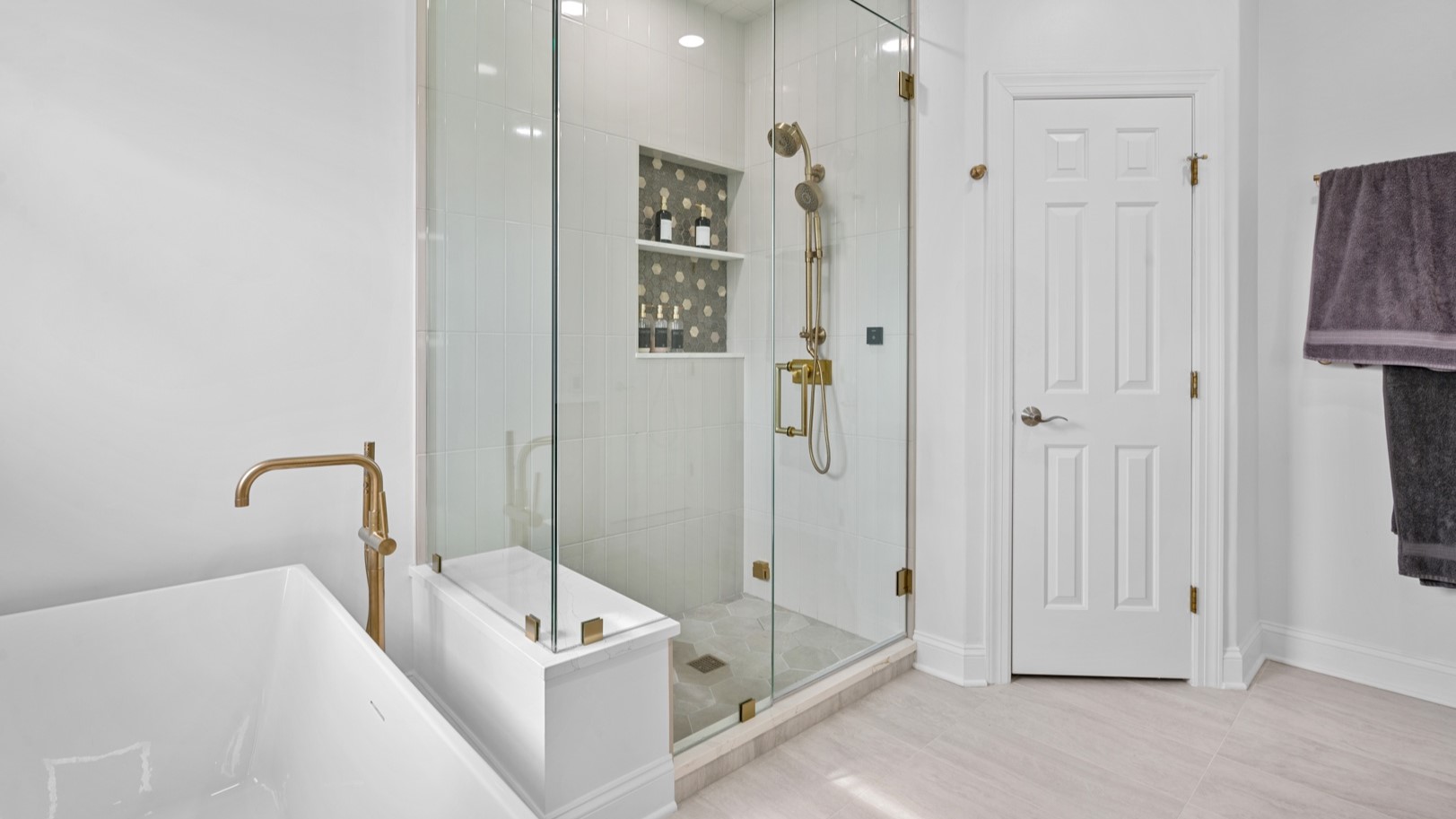 Brand new bathroom remodeling project by 4Ever Remodeling with new white bathtub and modern glass shower unit