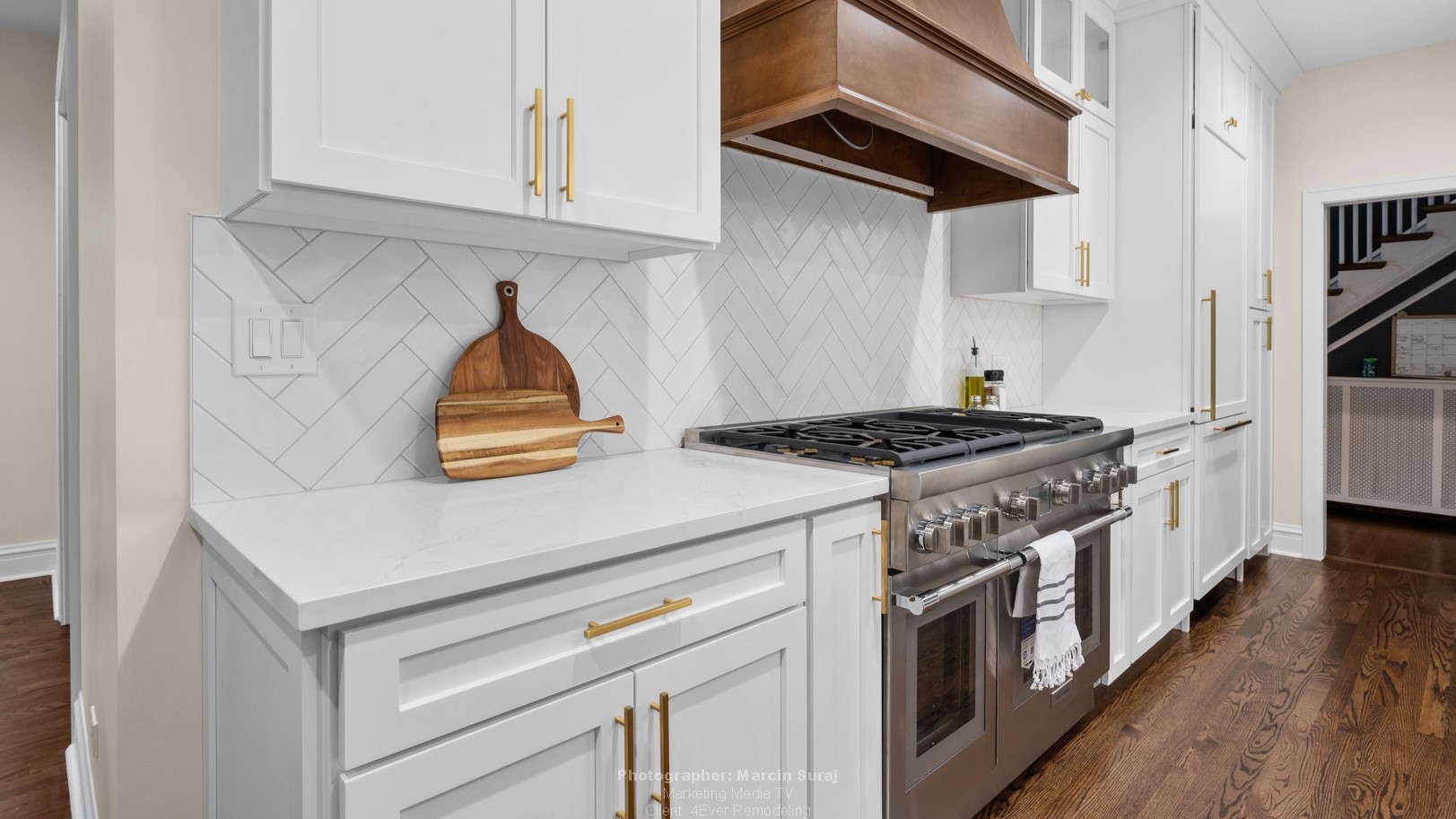 New kitchen by 4Ever Remodeling in Oak Park, IL with dark hardwood floors and white cabinetry