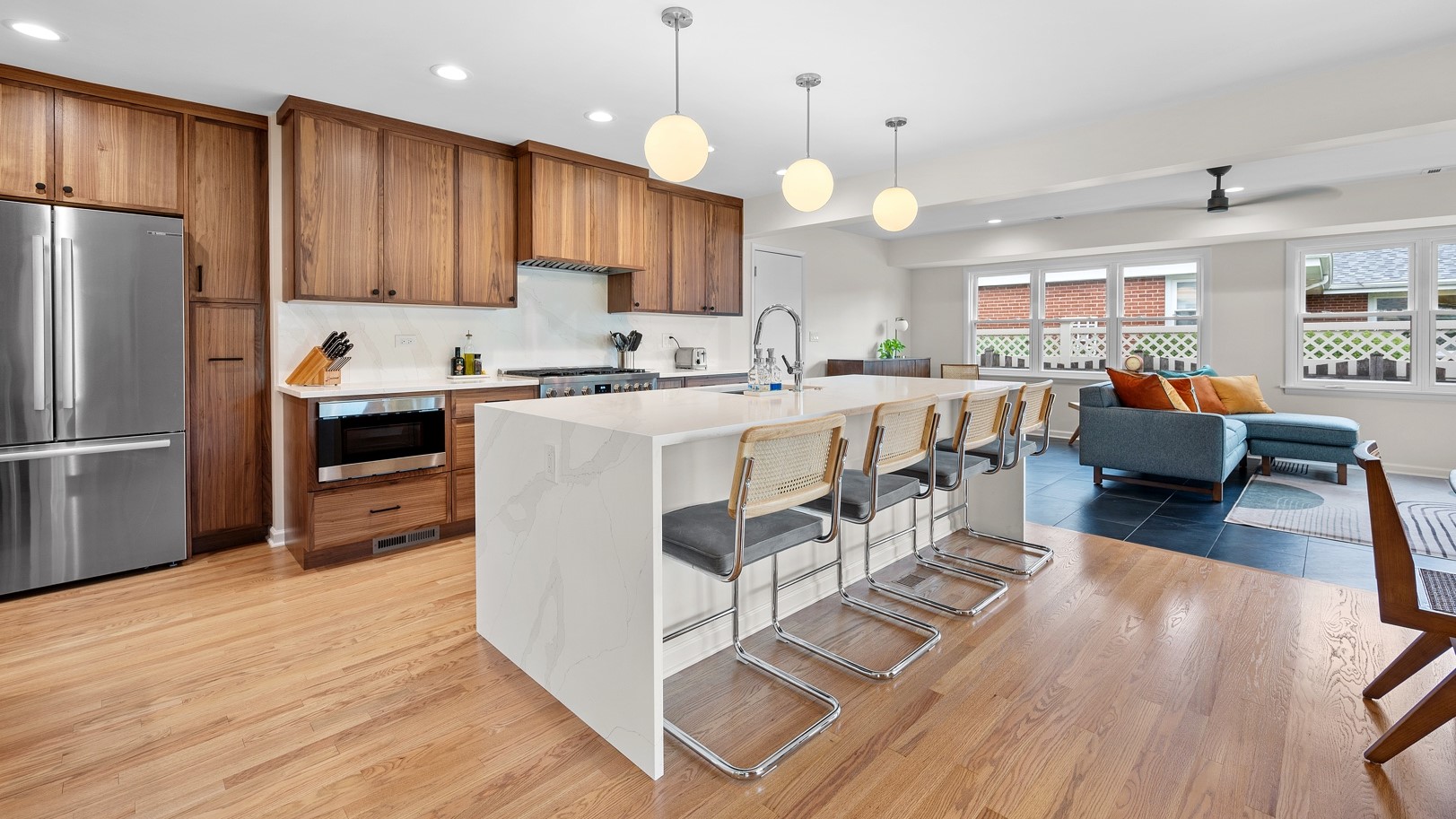 New home remodel by 4Ever Remodeling in Oak Park, IL with new hardwood floors, wooden cabinets, and beautiful marble countertops