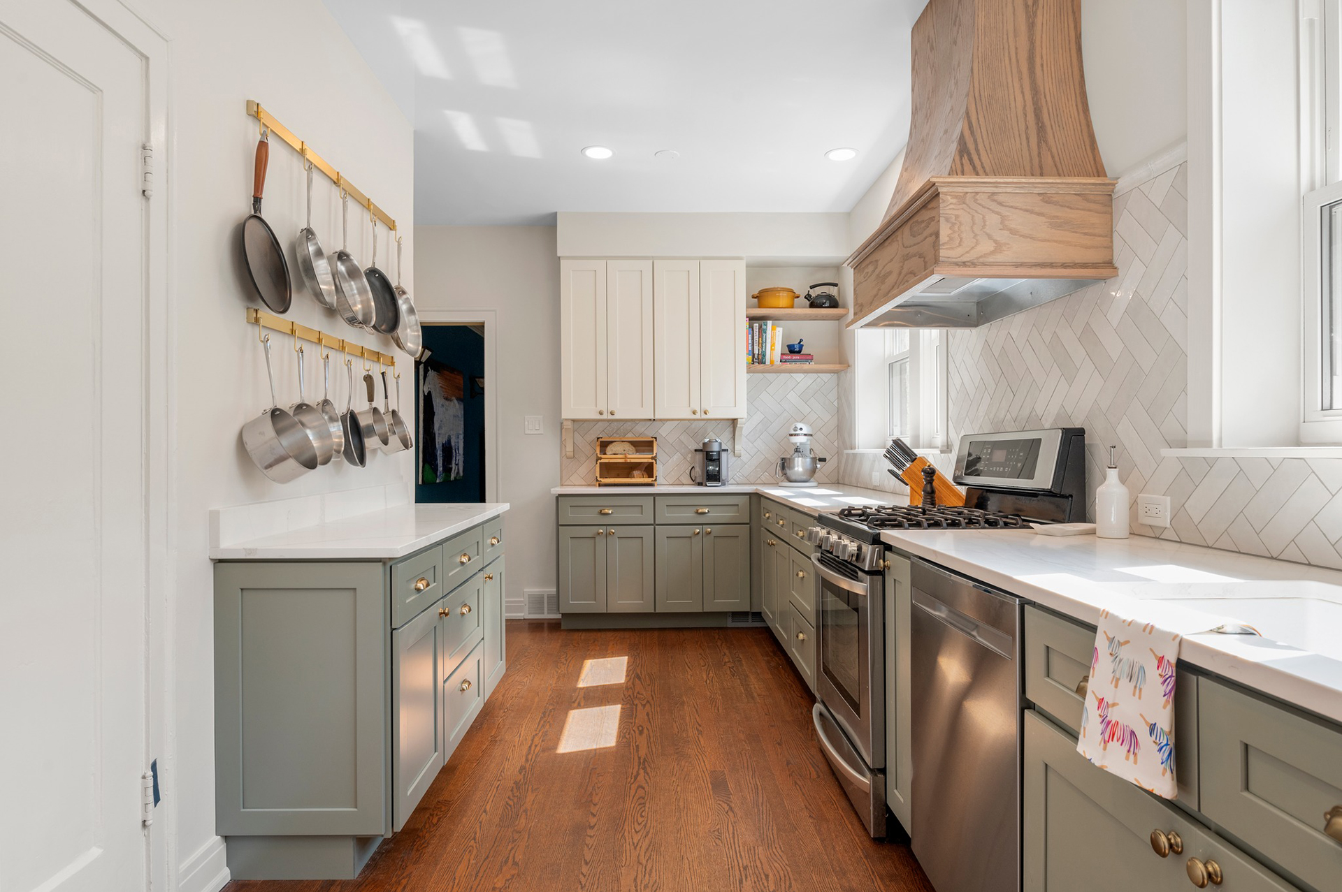 Kitchen With Green Cabinets and Light Countertops lazyload