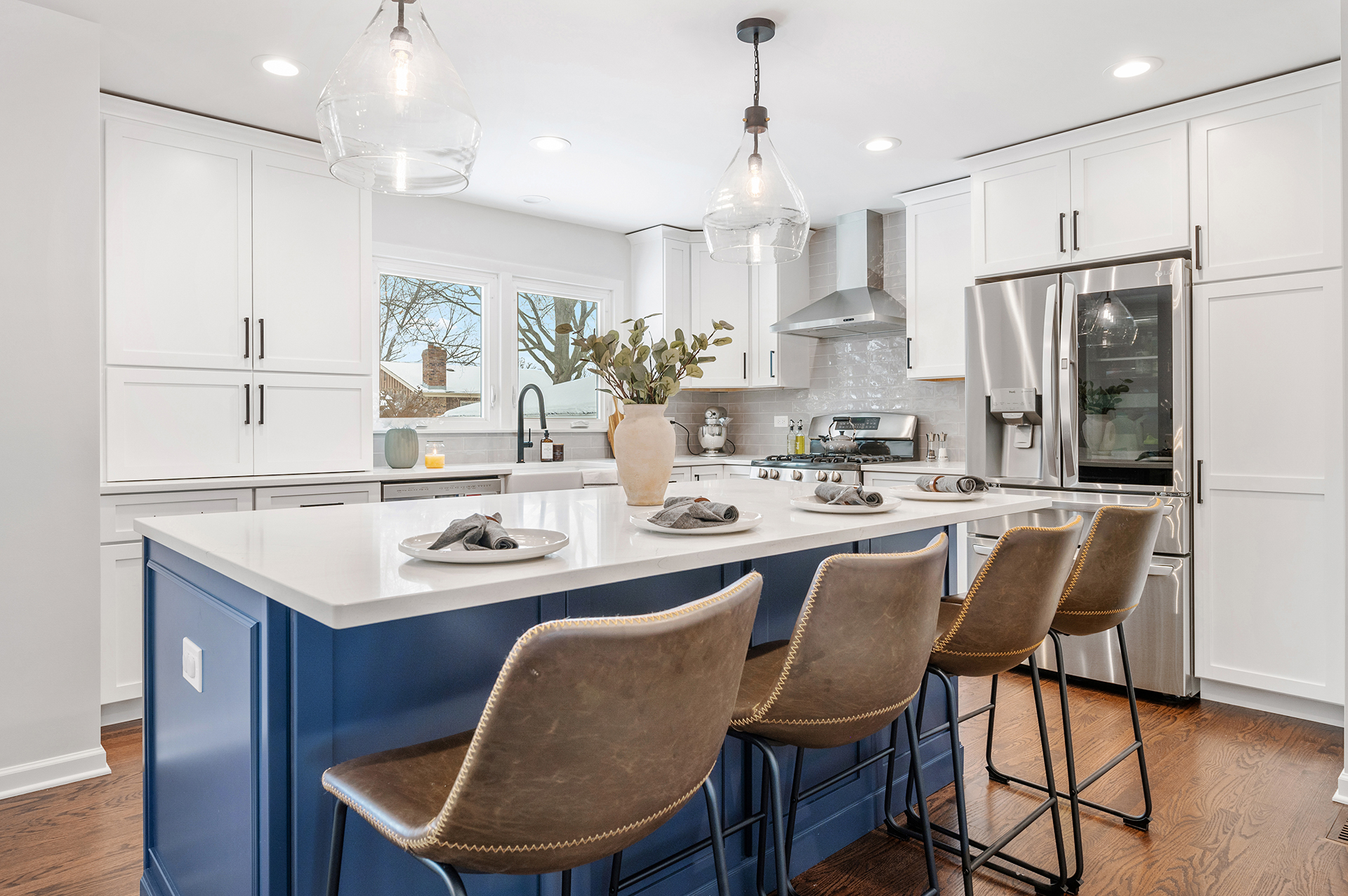 Large Kitchen with Blue Island and White Cabinets