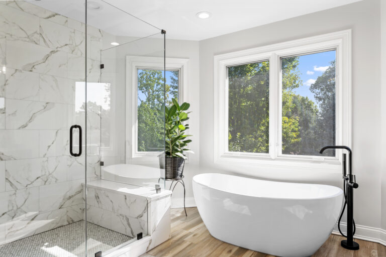 bathroom with update tub and windows
