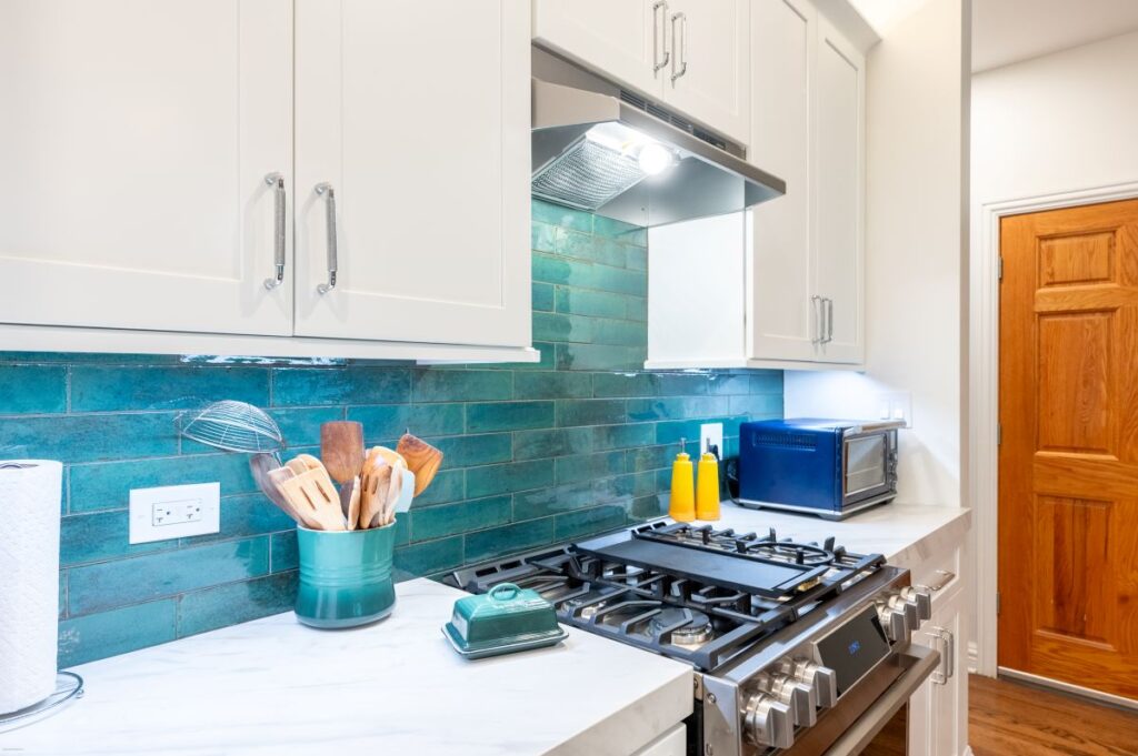 White kitchen with turquoise accents