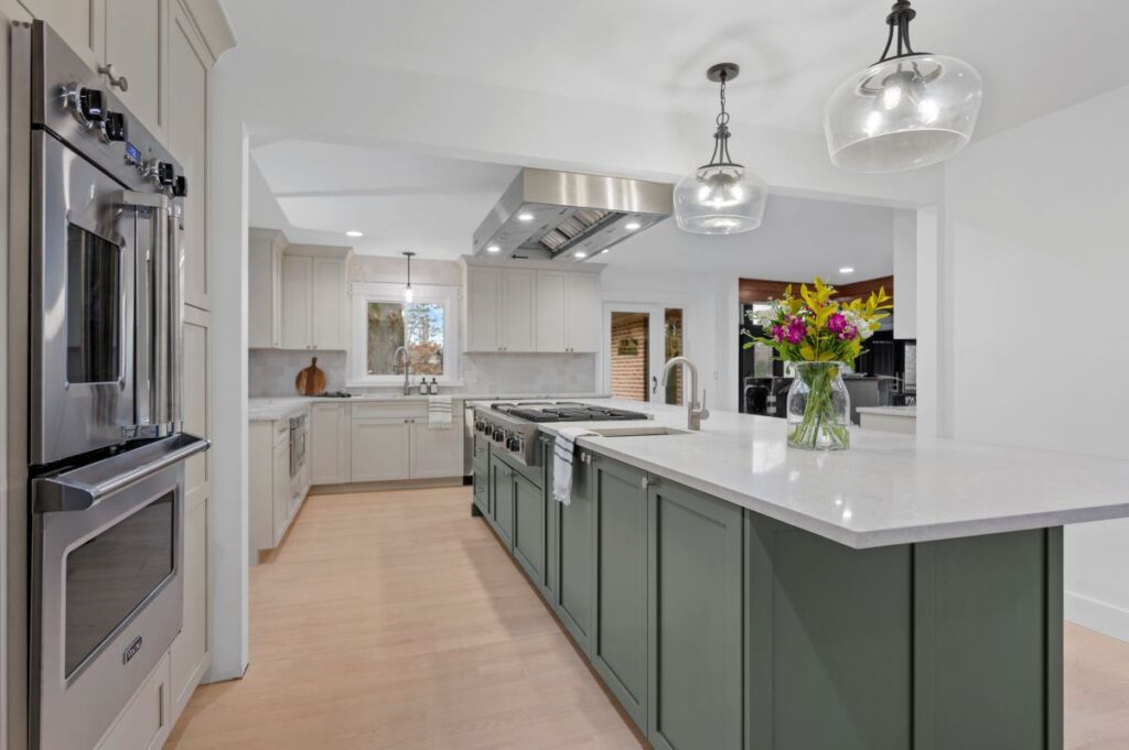 Newly installed white kitchen with green cabinets