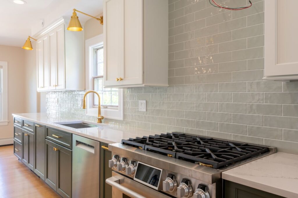 Grey and white kitchen with gold accents