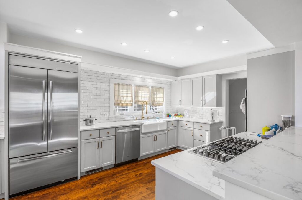 Large, bright kitchen with windows above the sink