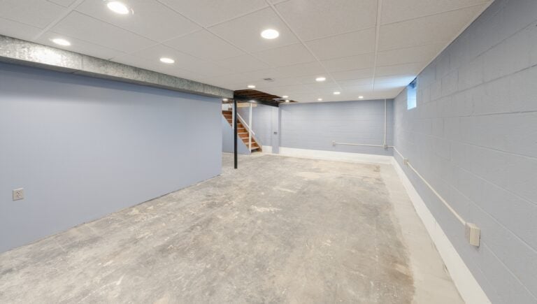 older home with unfinished basement has been water proofed and water damage repaired