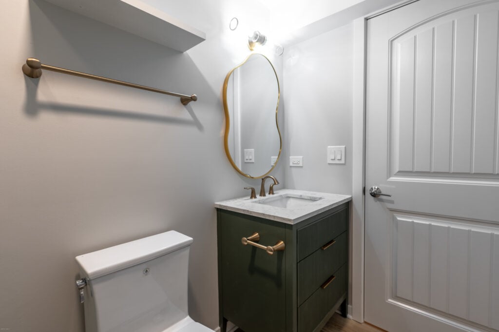 new bathroom with white wall and door