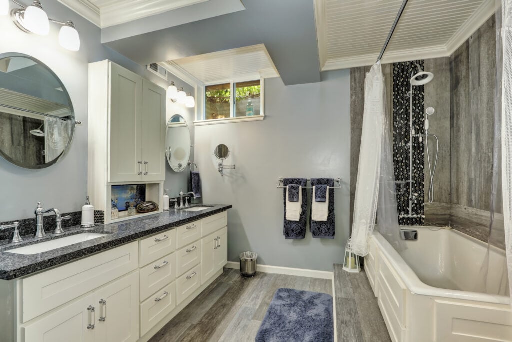 Basement bathroom interior in gray and white tones. Northwest, USA