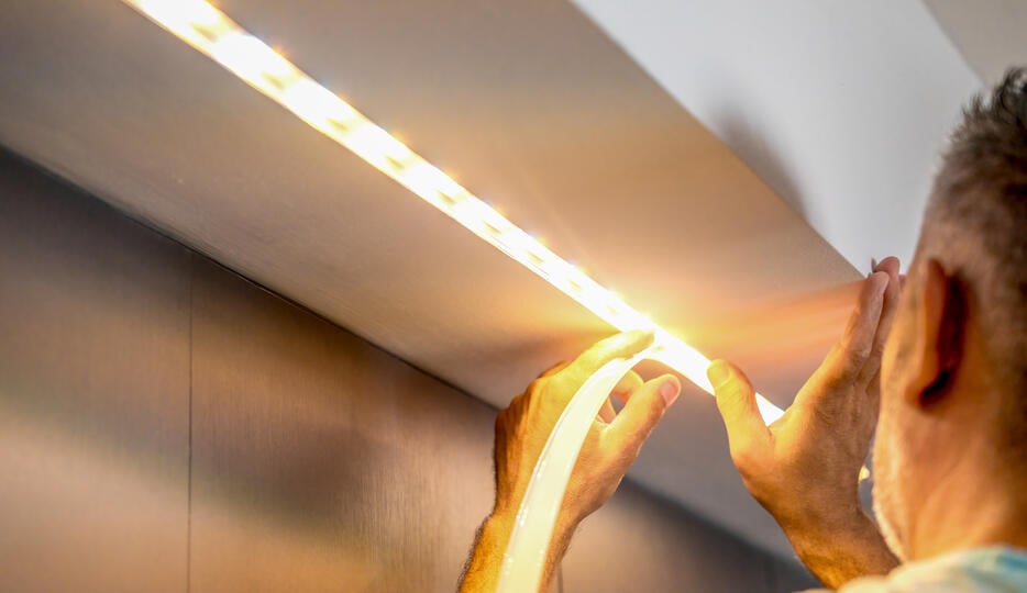 guy installing new light